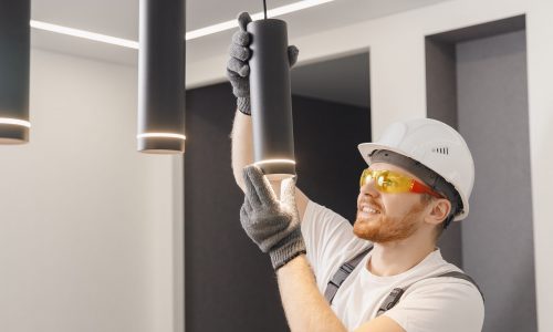 Electrician,Installs,Lamp,Lighting,And,Spot,Loft,Style,On,Ceiling.
